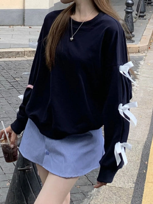 Dark blue round-neck sweatshirt with white bow ties on long sleeves