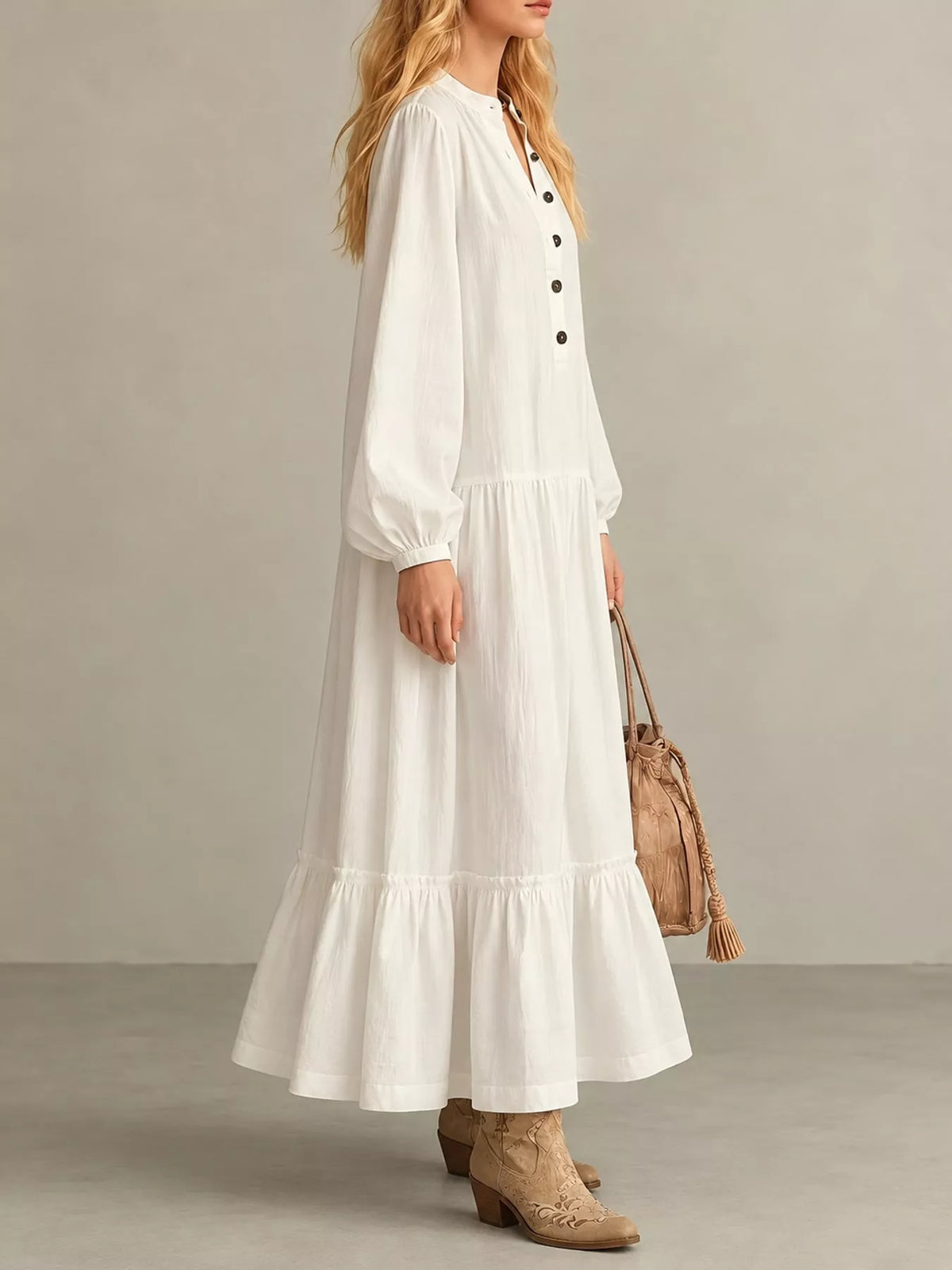 Ivory tiered maxi dress with button placket and long puff sleeves, side view