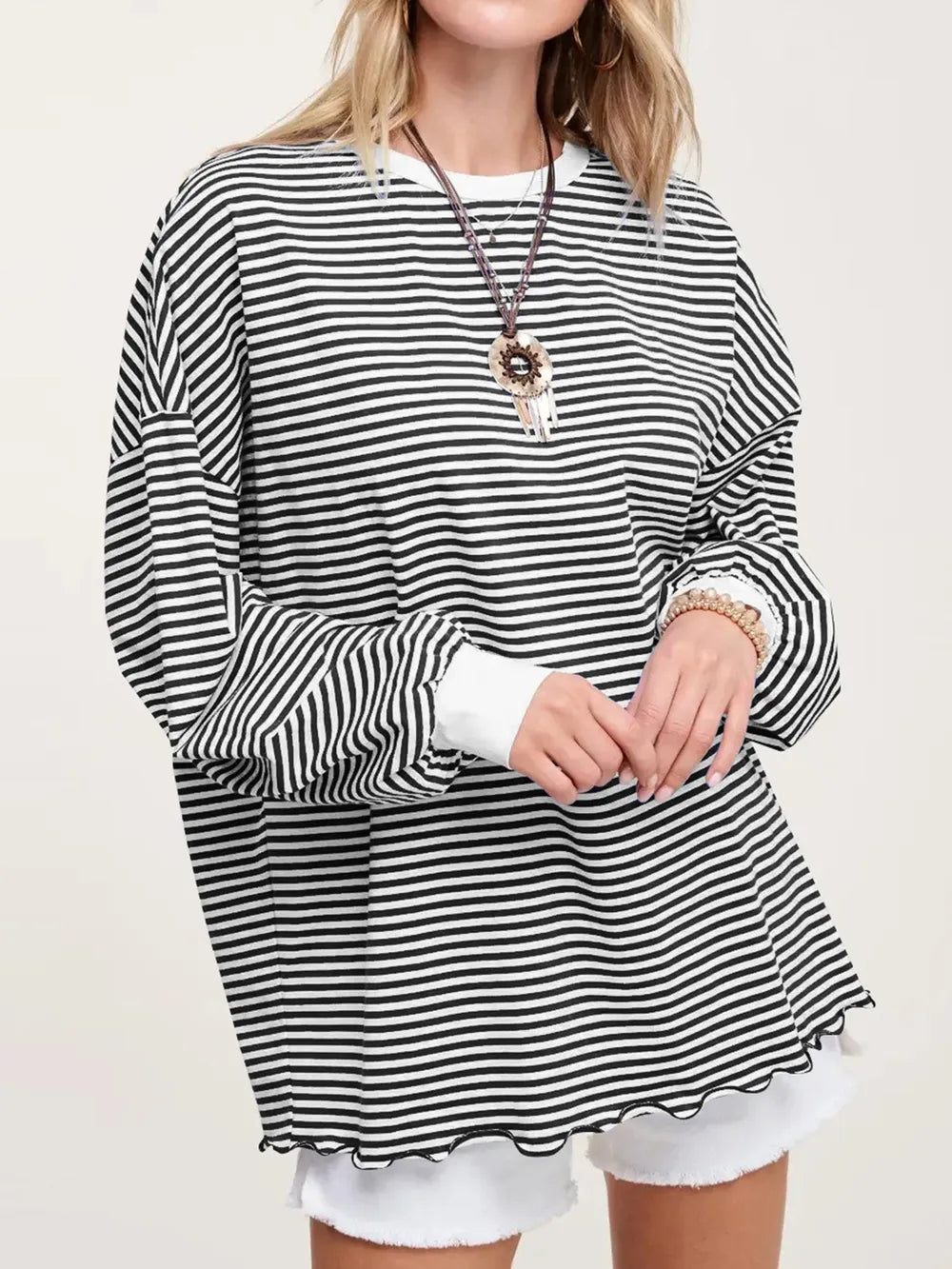Contrast striped long sleeve sweatshirt in black and white with loose fit and dropped hem