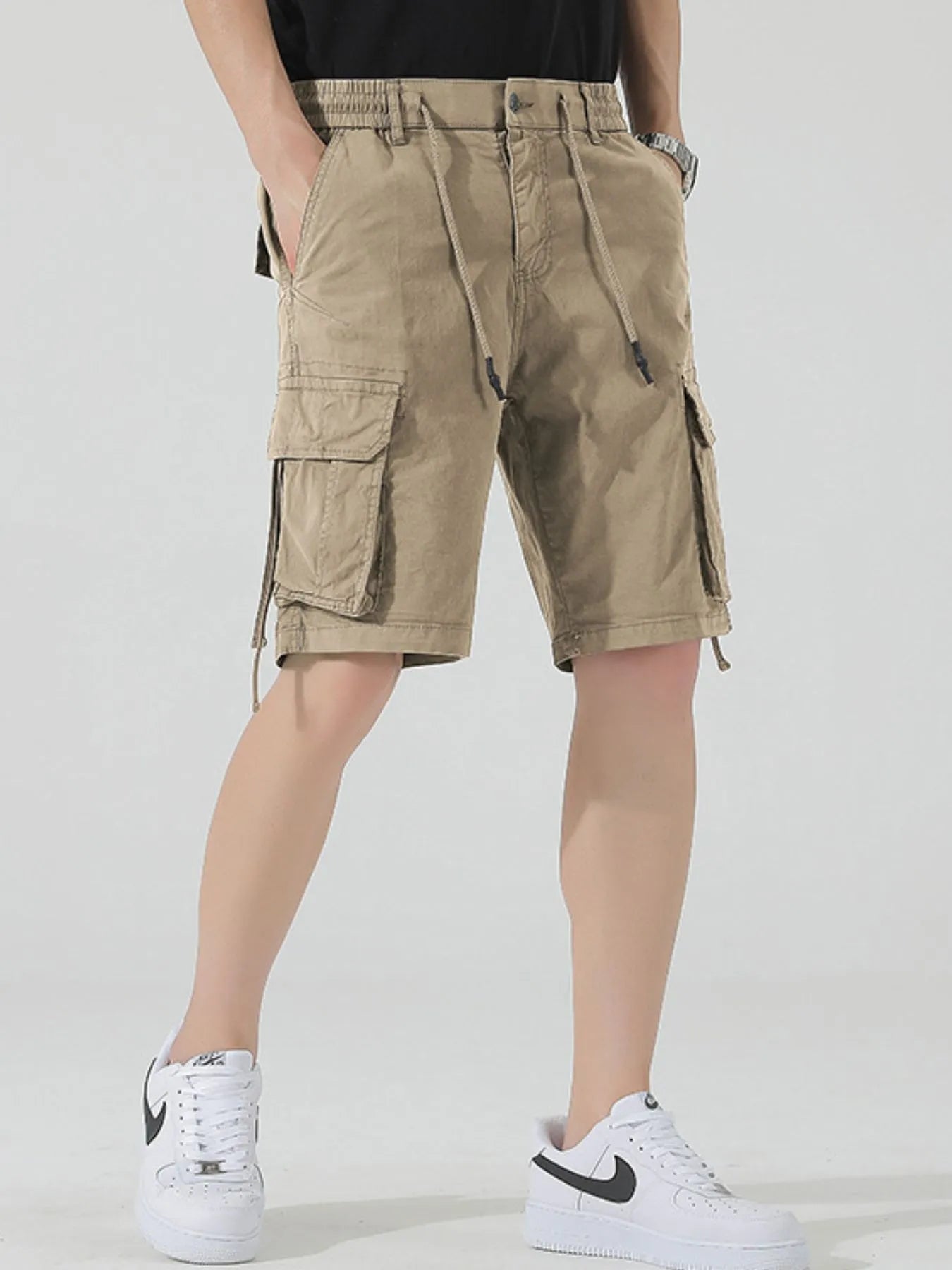 Men's khaki drawstring cargo shorts with flap cargo pockets and drawstring hem