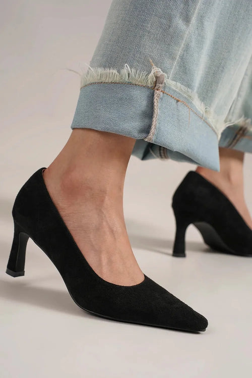Black faux suede point-toe pumps with mid-height stiletto heel, side view