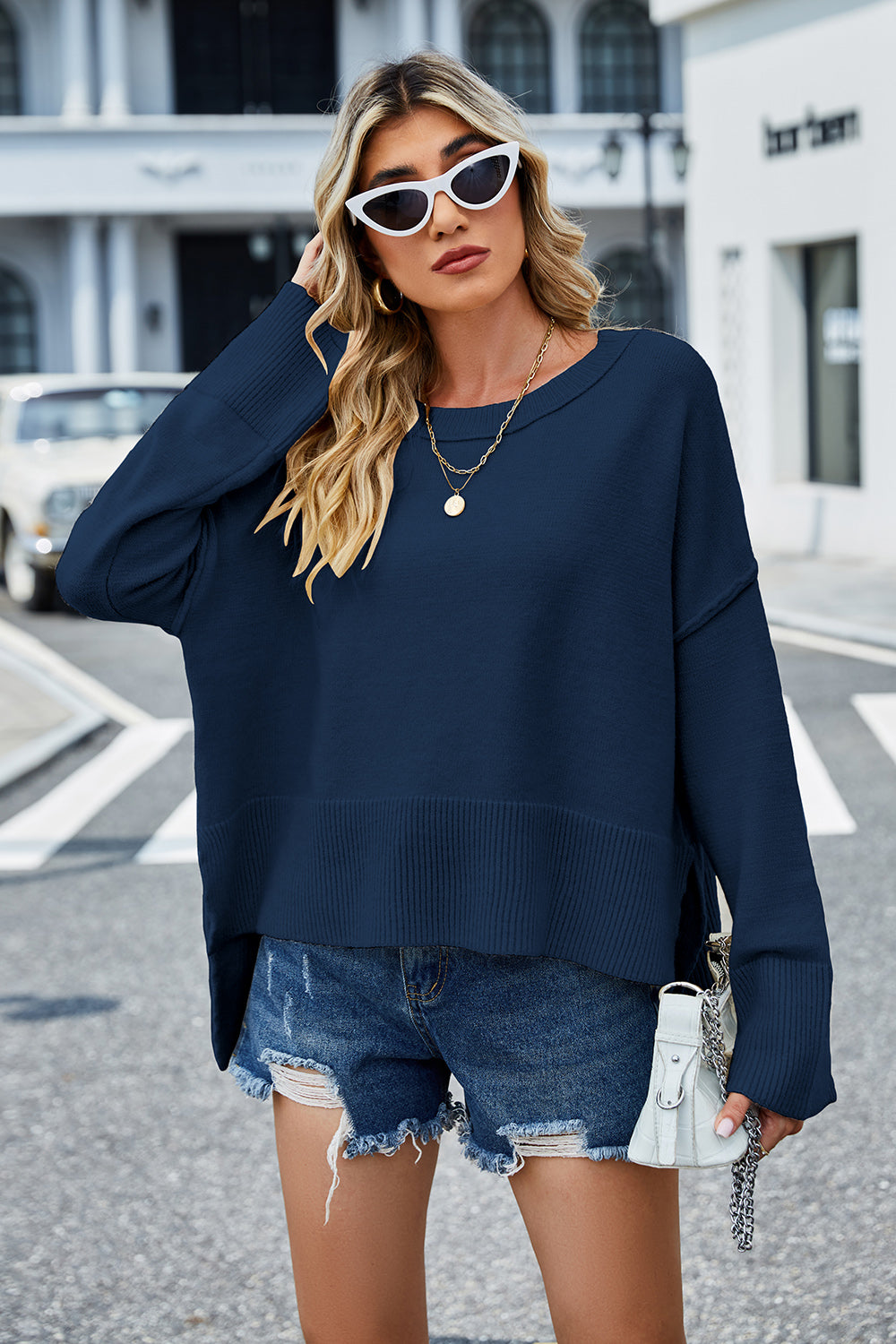 Peacock blue round-neck dropped-shoulder sweater with ribbed mid hem and cuffs