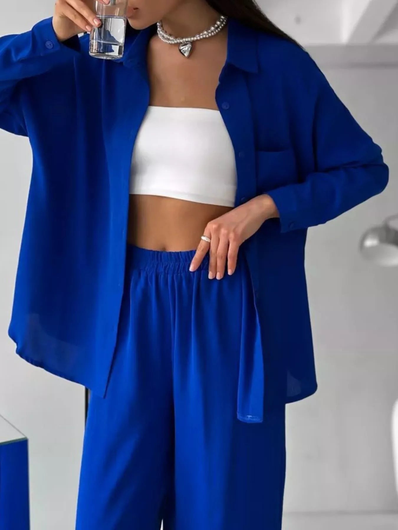 Blue relaxed-fit shirt and wide-leg pants set, open shirt over gathered waist pants