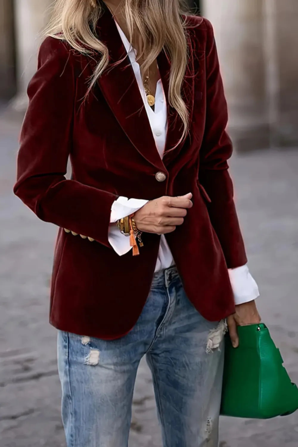 One-button lapel blazer in burgundy with long sleeves and single front button.