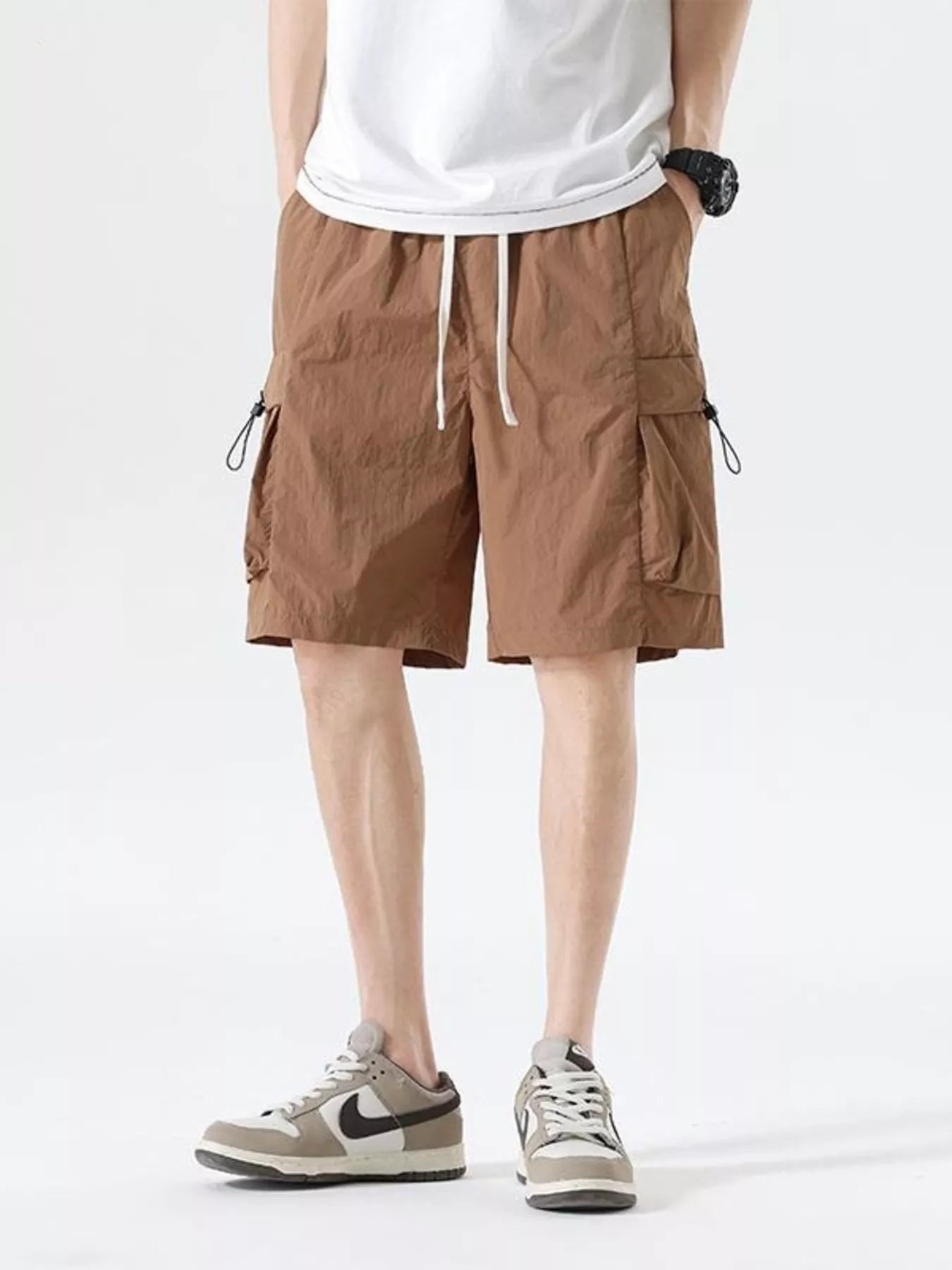 Brown drawstring cargo shorts with side cargo pockets and drawcord waist