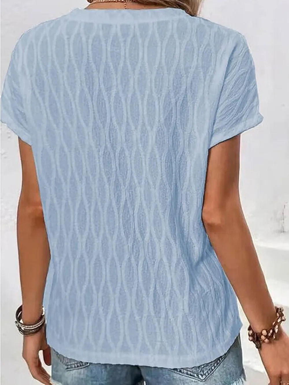 Light blue patterned short-sleeve T-shirt, round neck, back view