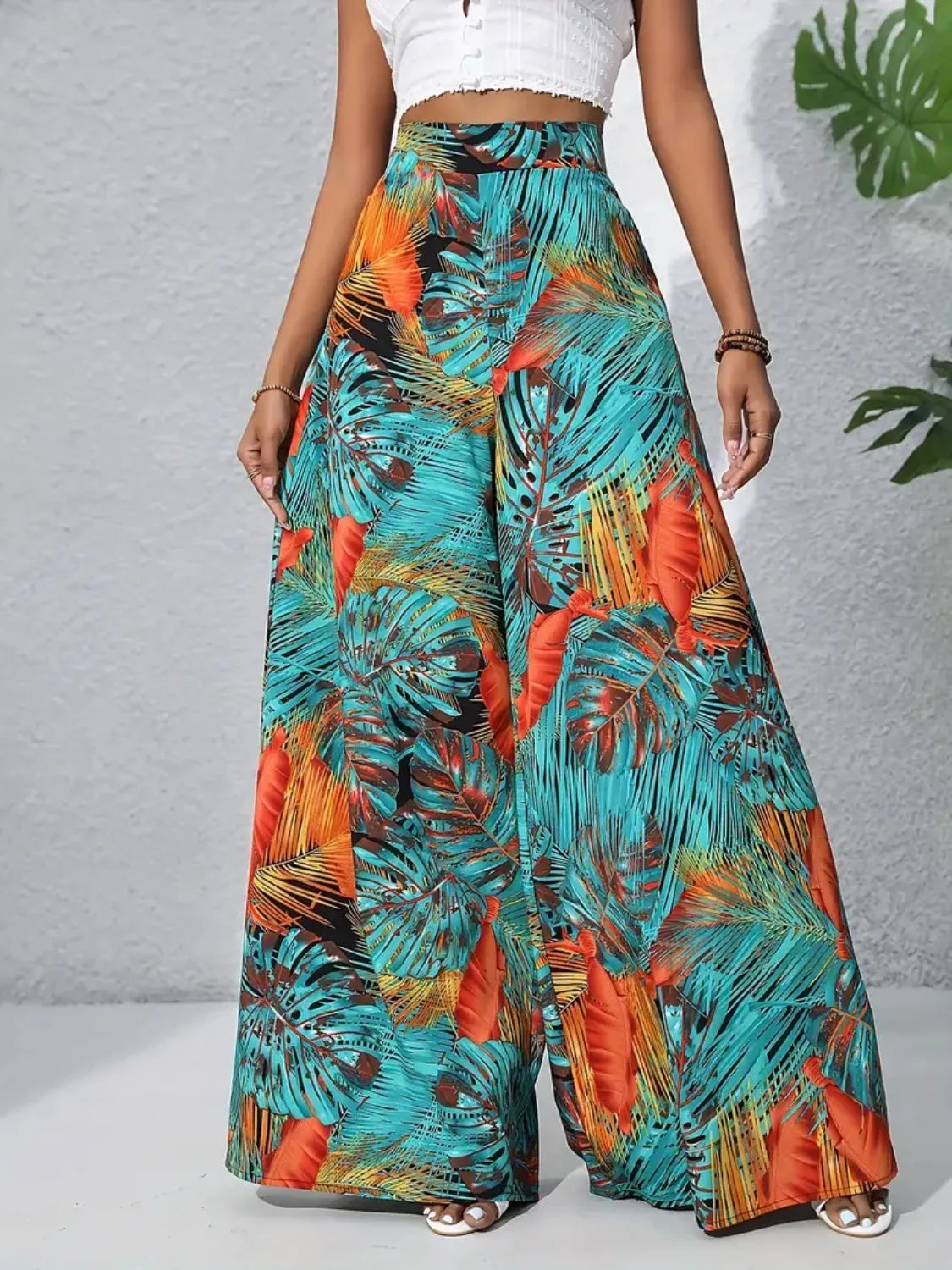Printed high waist wide-leg pants, teal and orange tropical leaf print, flowy wide legs