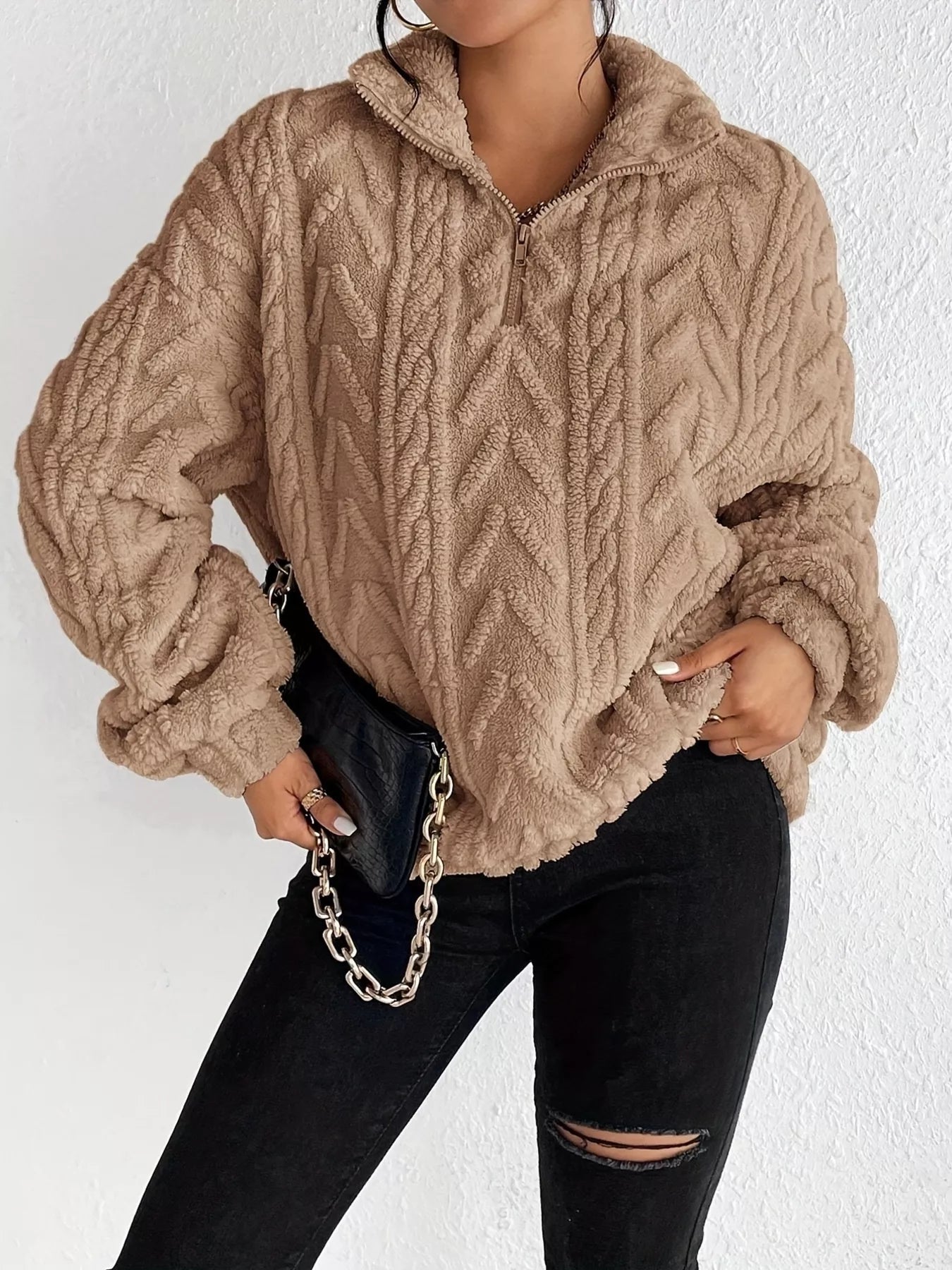 Apricot sherpa quarter-zip sweatshirt with cable knit pattern and dropped sleeves
