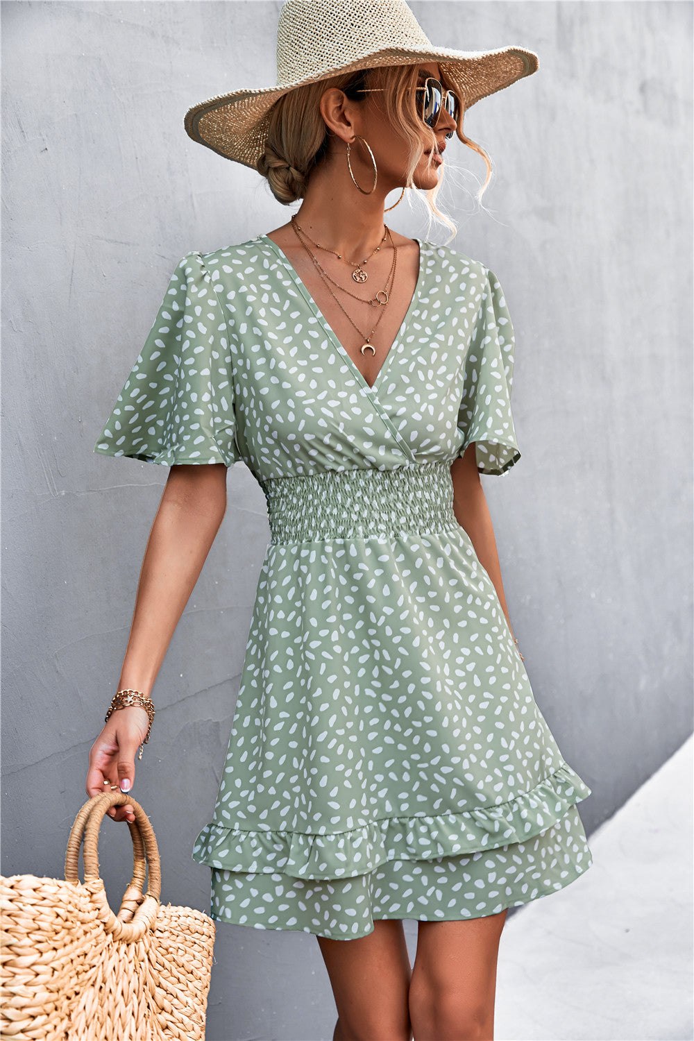 Green leaf printed surplice dress with smocked waist and layered tiered hem