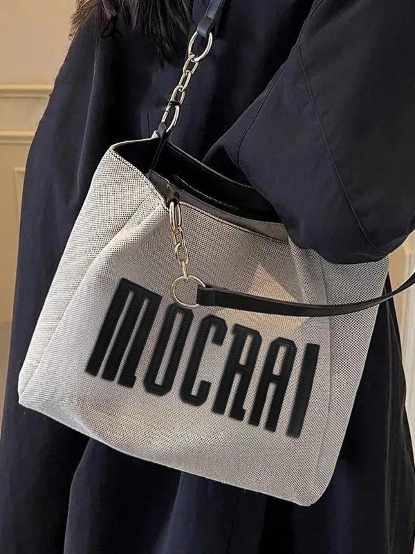 Letter Canvas Shoulder Bag, medium gray canvas with bold black lettering and silver chain strap.