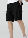 Black drawstring cargo shorts with pleated front and side cargo flap pockets