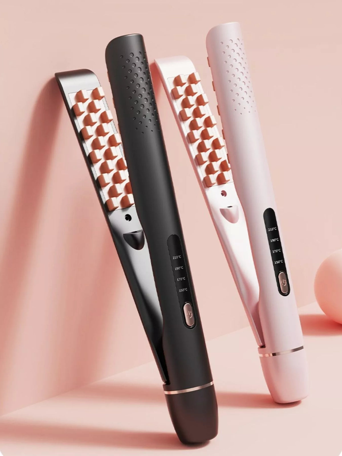 Black and blush pink hair straighteners standing side by side with flat plate designs