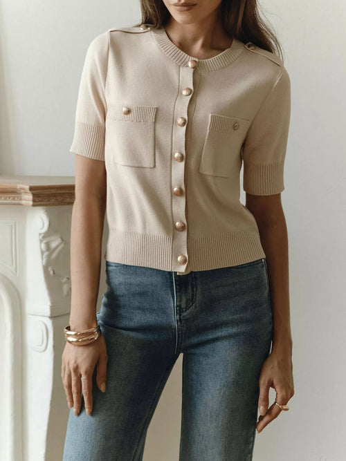 Beige ribbed short-sleeve cardigan with button front and patch pockets