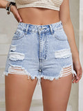 Light blue high-waist denim shorts with distressed rips and frayed raw hem