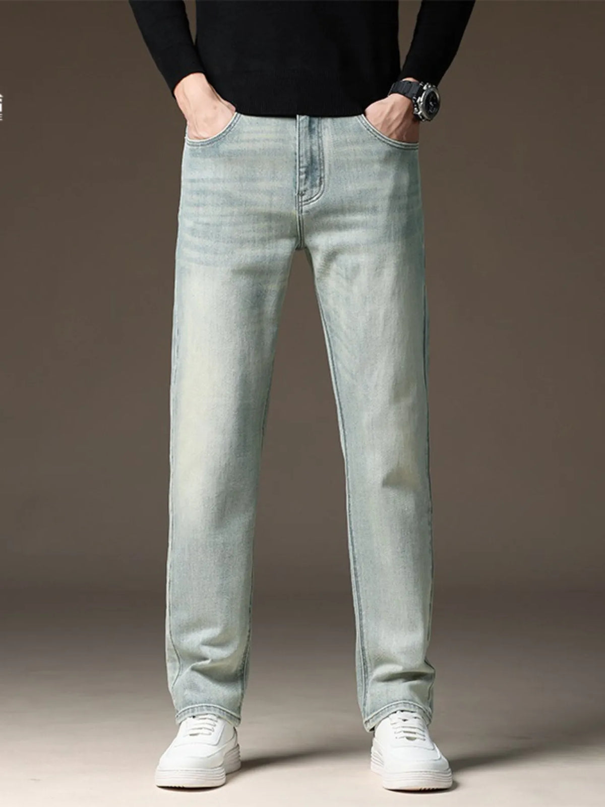 Men's light wash straight-leg jeans, zip fly and stitched front pockets