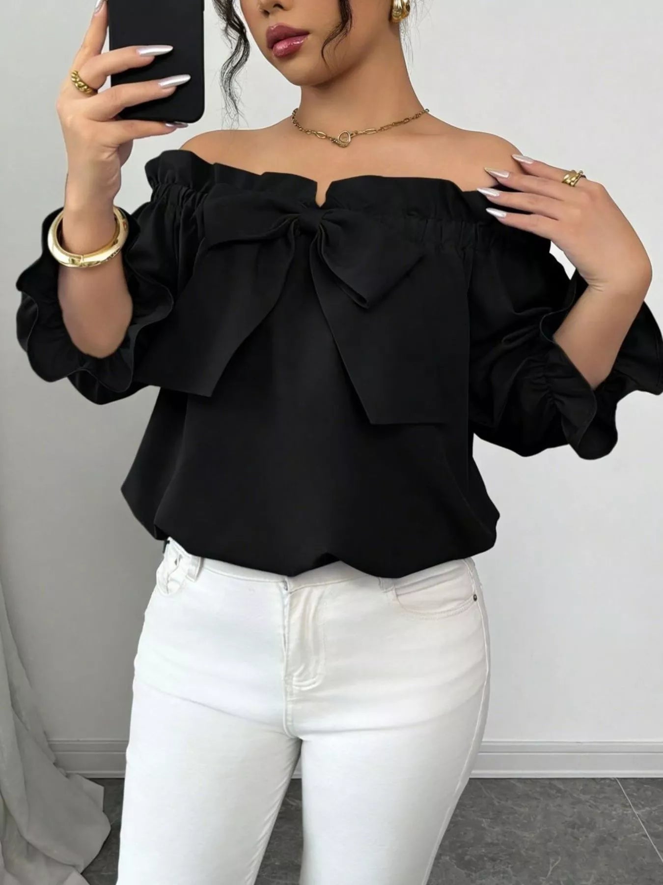 Bow Flounce Sleeve Blouse in black with off-shoulder neckline and puff sleeves
