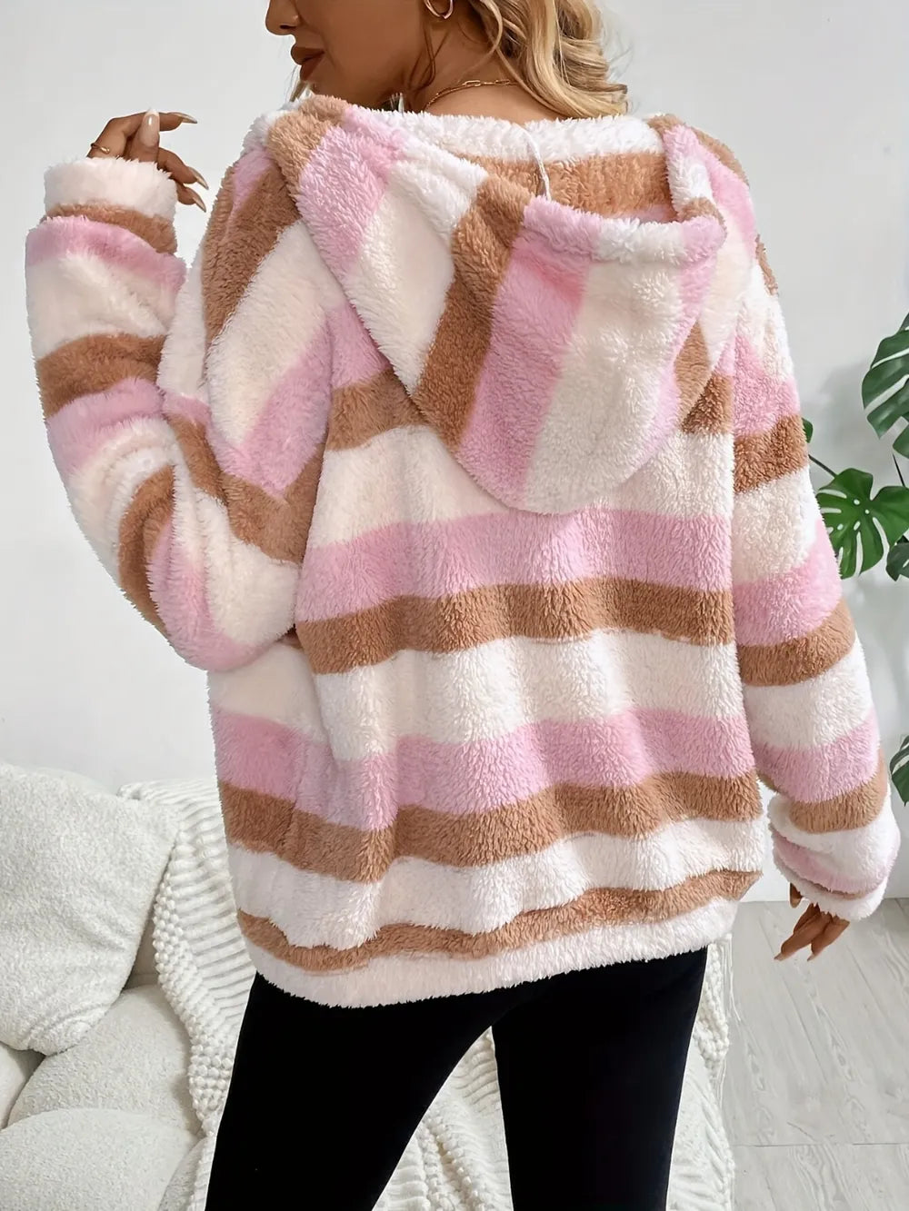 Striped hooded zip-up jacket with blush pink, cream, and brown horizontal bands, back view