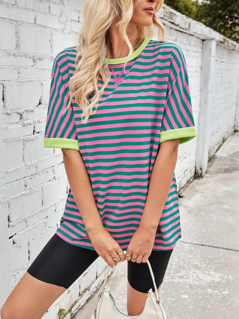 Green and white striped round-neck half-sleeve T-shirt with yellow ribbed trim and curved hem