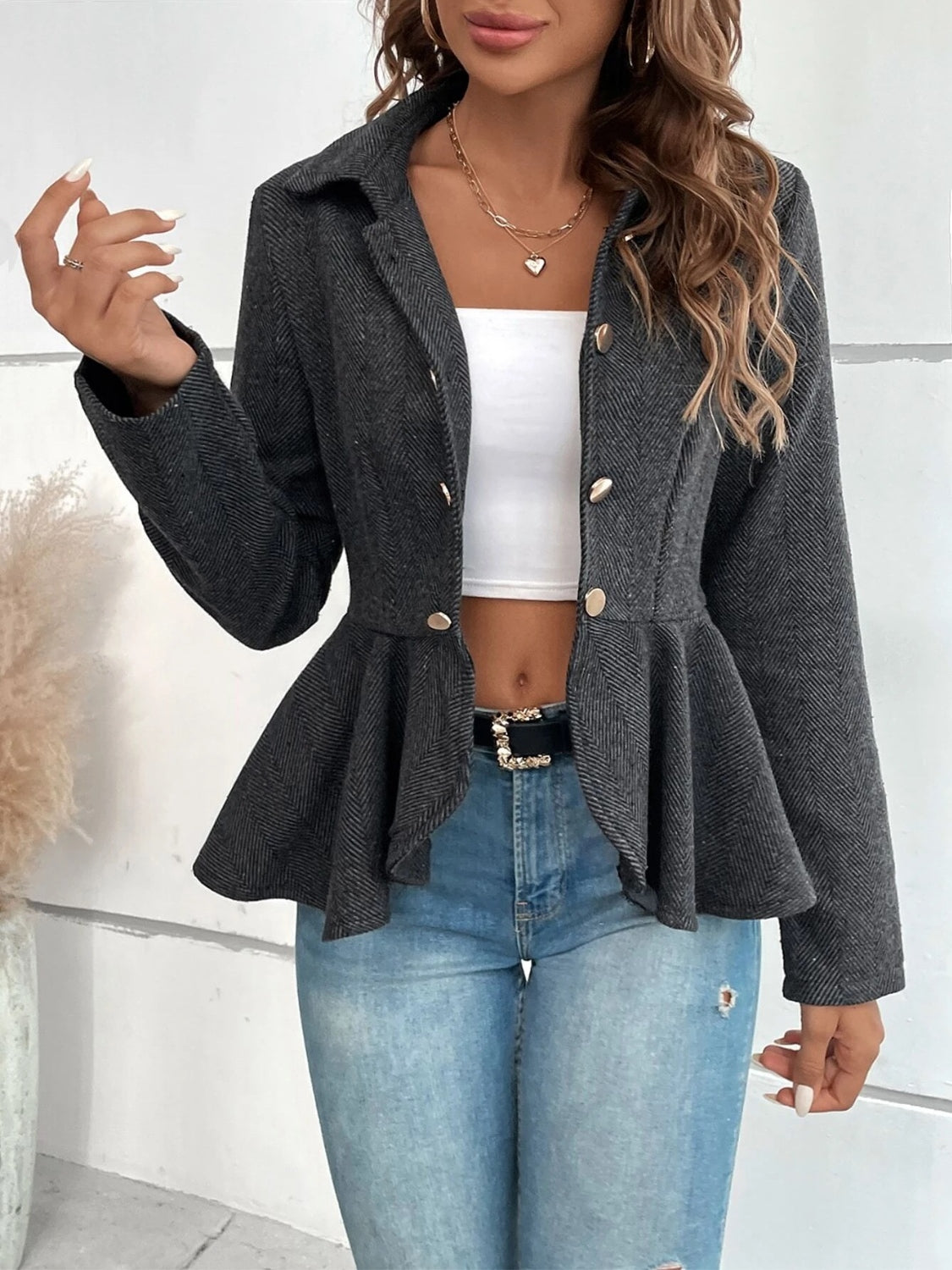 Dark charcoal collared blazer with ruffle hem peplum and gold button front