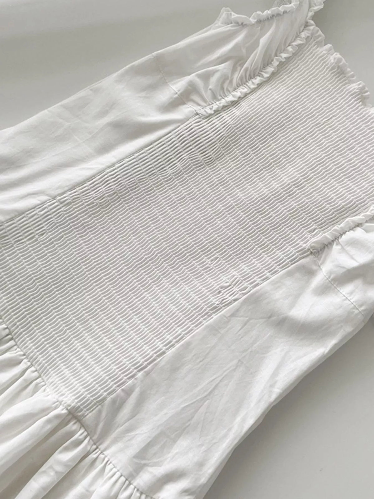 White cotton maxi dress bodice with textured striped center and ruffled trim