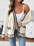 Cream knit cardigan with black and tan contrast trim, button front, long sleeves