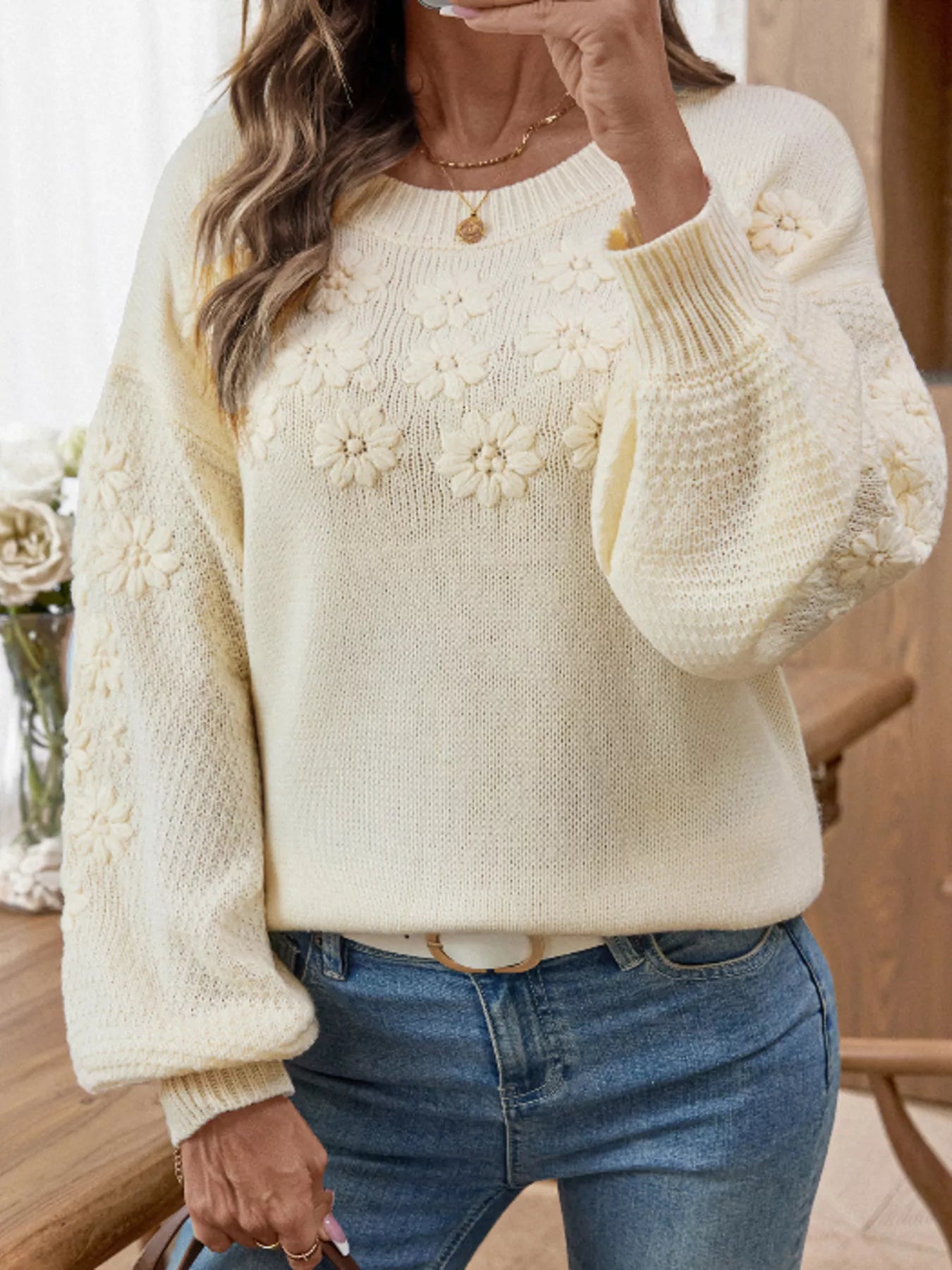 Cream floral knit sweater with round neck and long sleeves, knit flower pattern