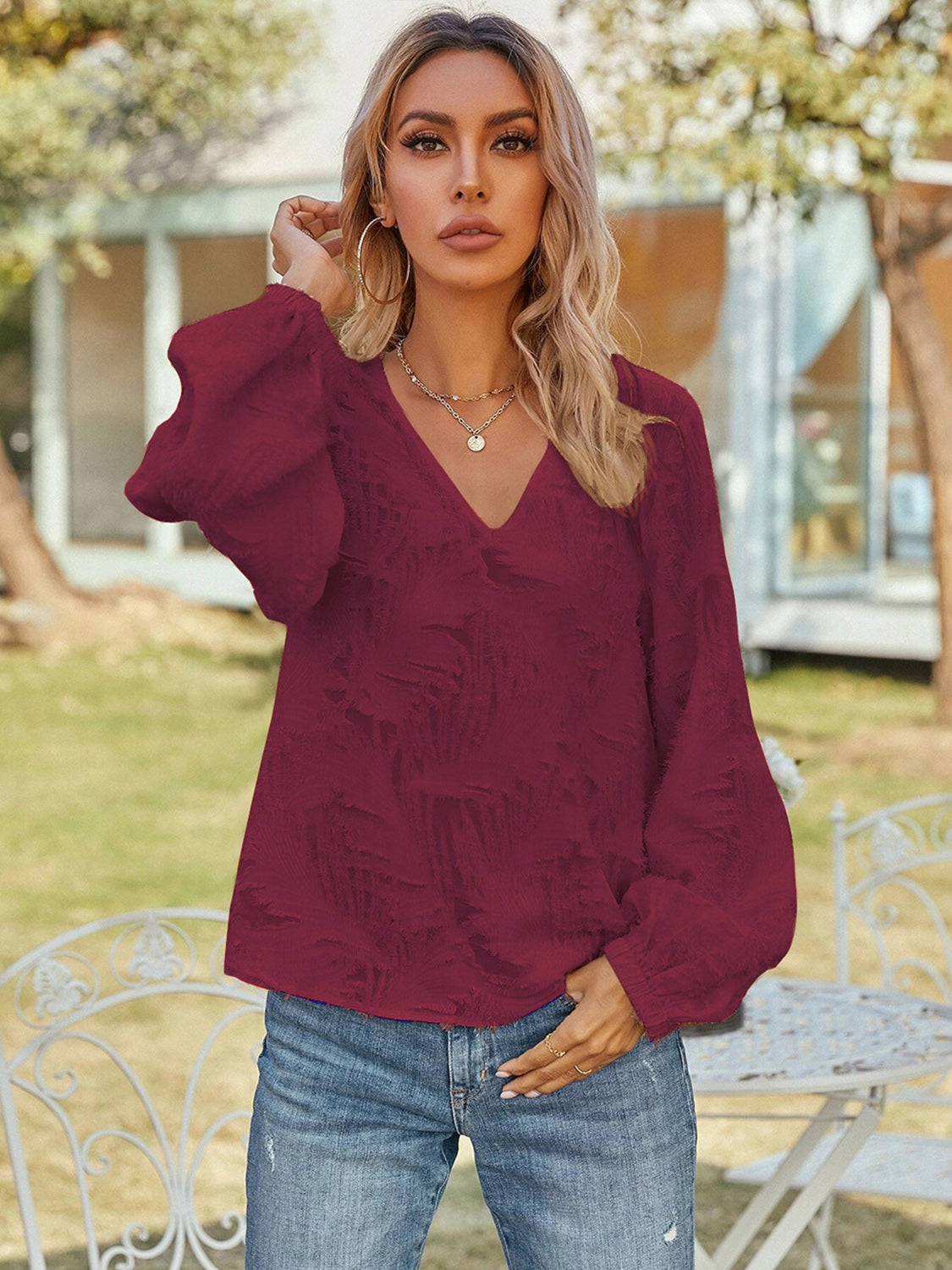 Burgundy V-neck long-sleeve blouse with gathered cuffs and puff sleeves