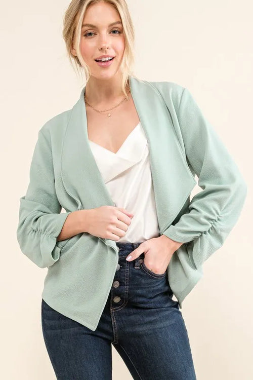 Mint open-front stretch blazer with long sleeves and notch lapels