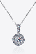 Round moissanite pendant necklace in sterling silver, detailed halo and drop design