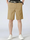 Loose-fit pocketed shorts, khaki beige with belt loops and front crease