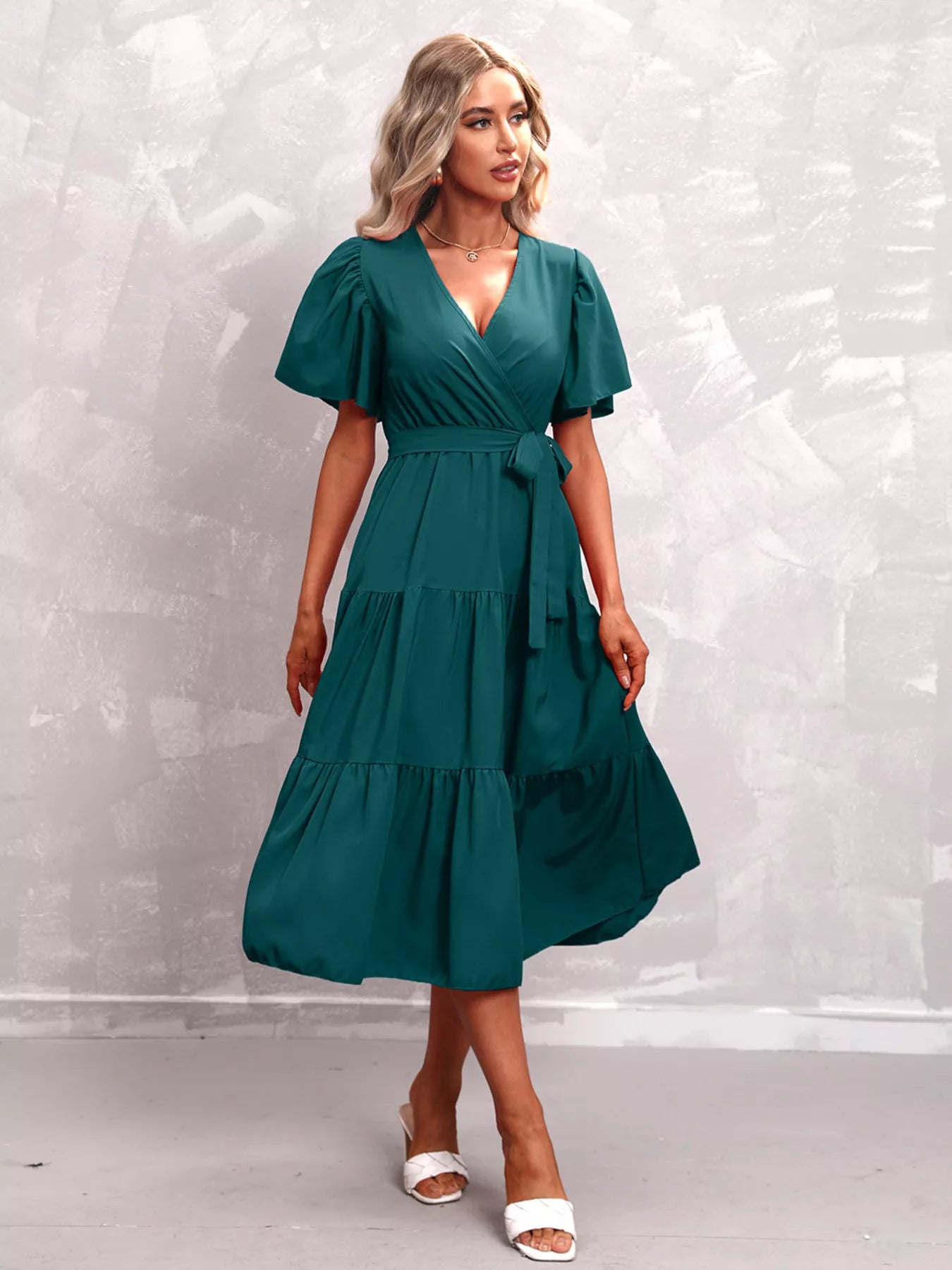 Teal tiered midi dress with V-neck, flutter sleeves, tie waist belt, tiered skirt