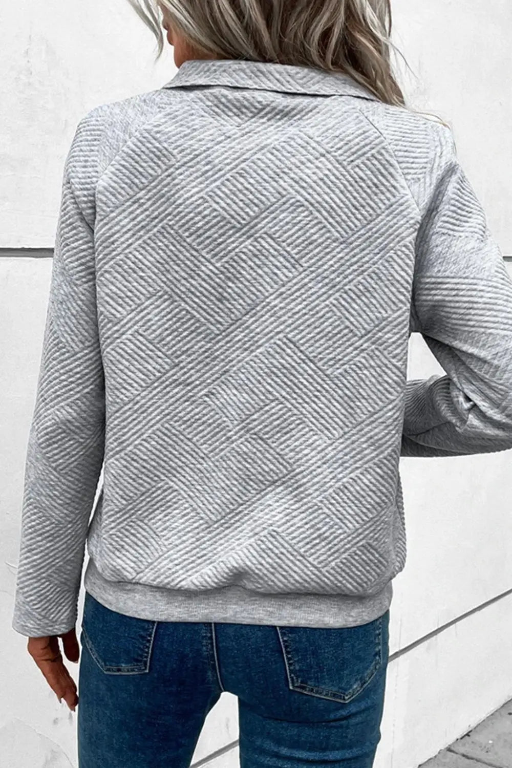 Back view light gray snap-button long-sleeve sweatshirt with geometric chevron pattern