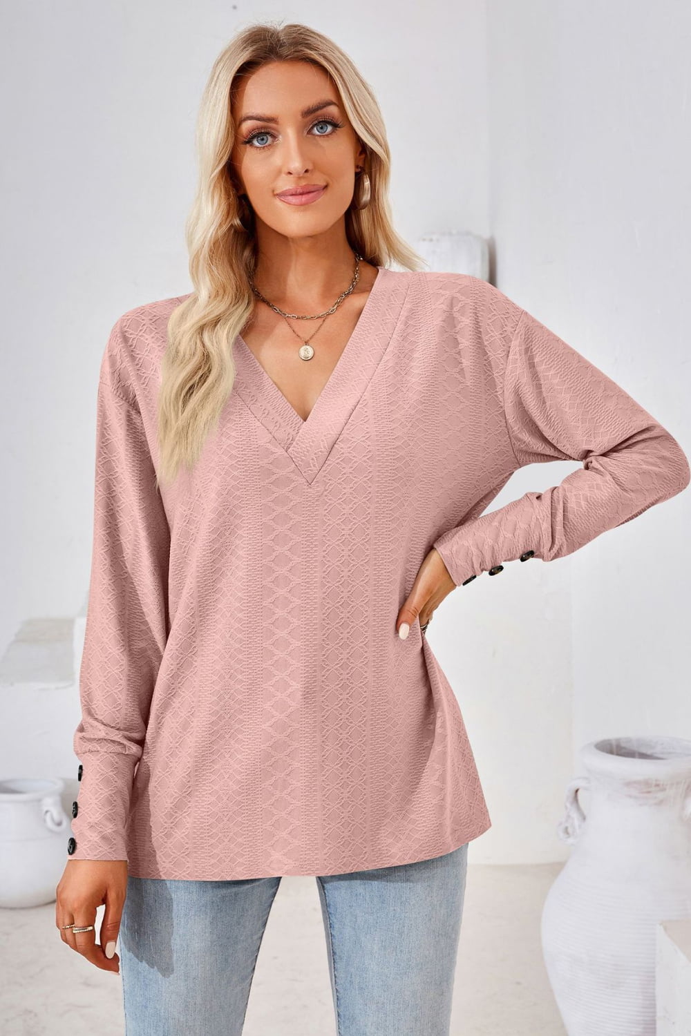 Dusty pink V-neck long-sleeve blouse with diamond texture and relaxed fit