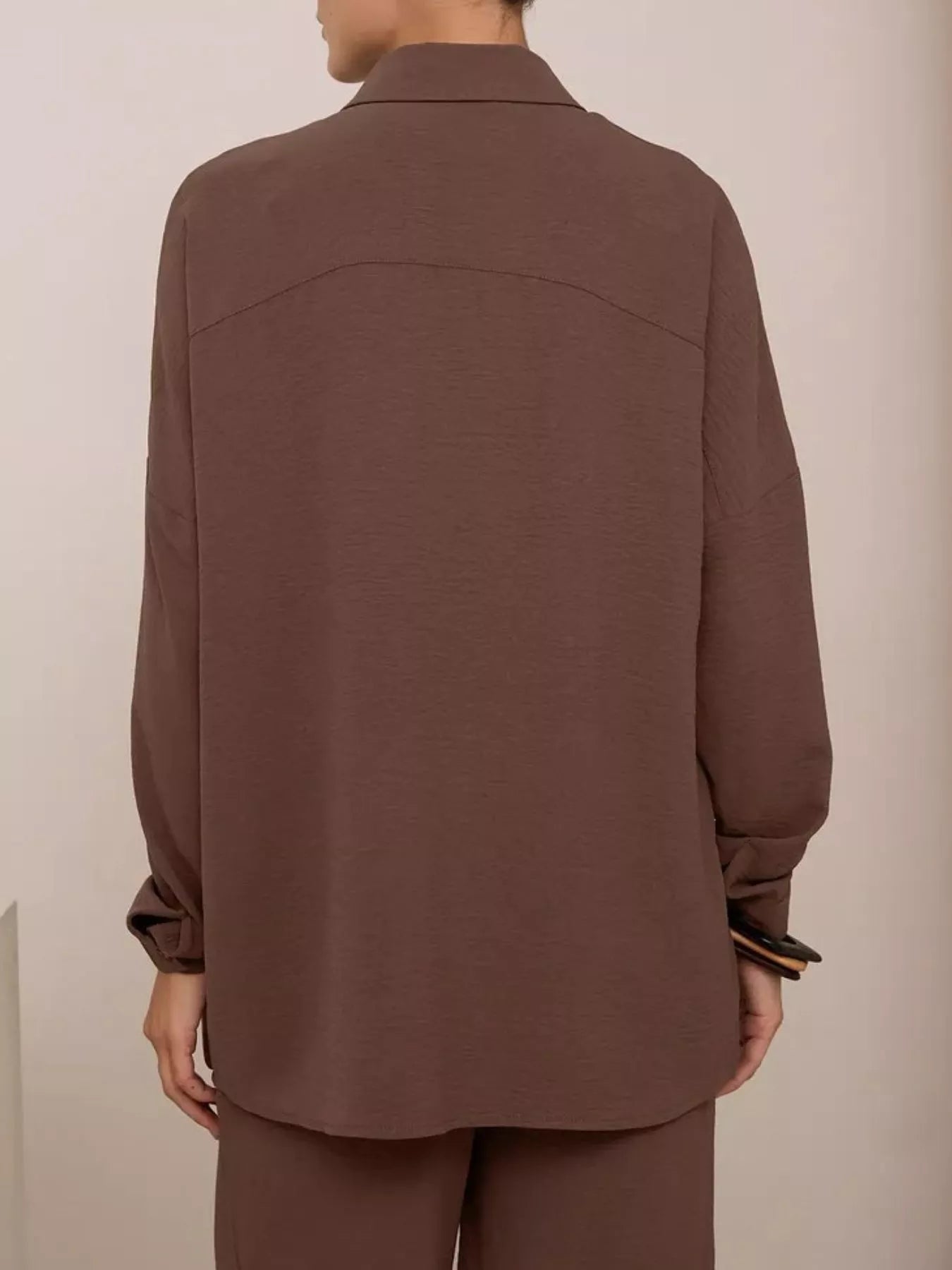 Brown relaxed shirt and wide-leg pants set, back view of button-front shirt and pants