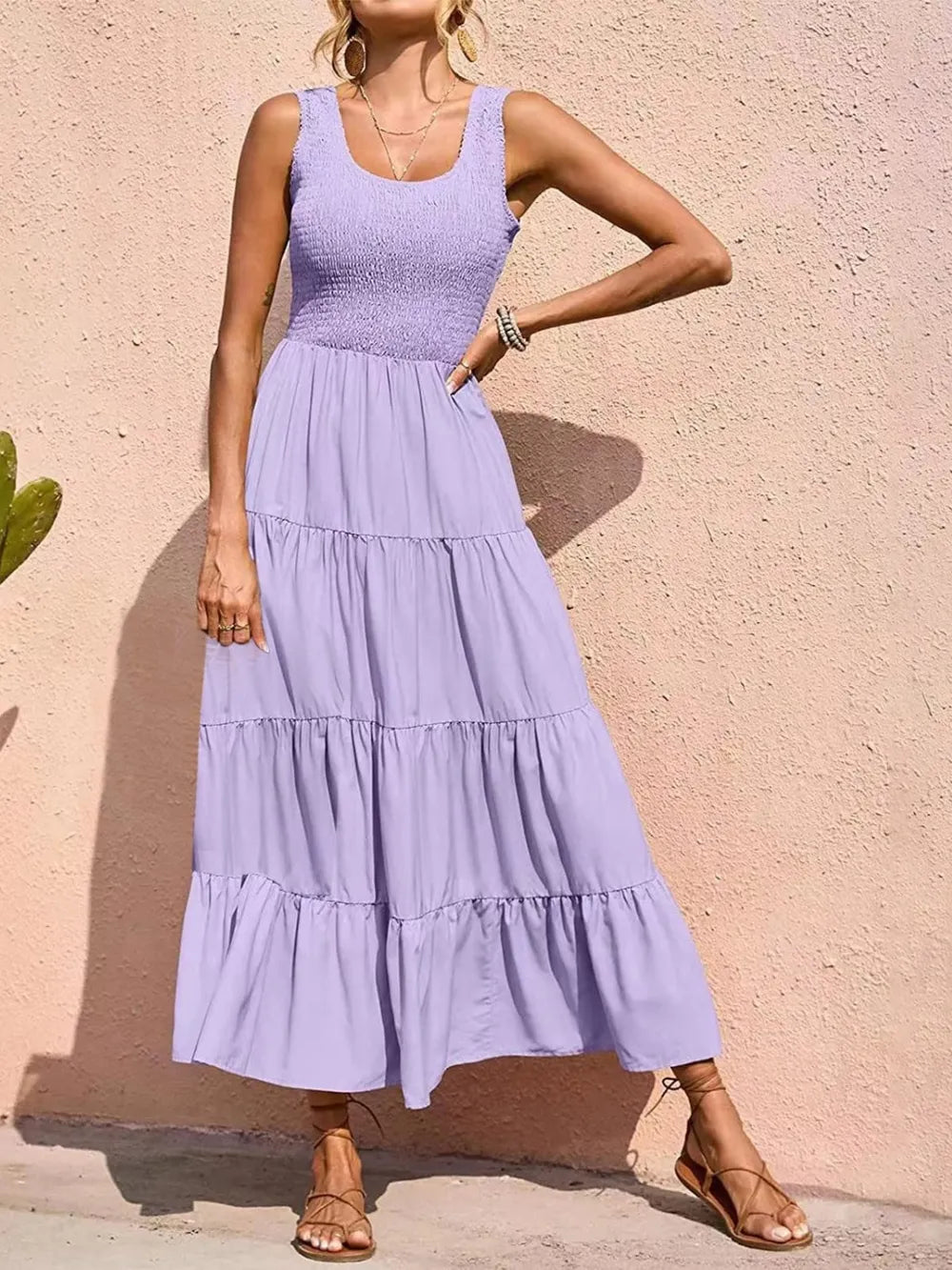 Tiered smocked wide strap dress in lavender with tiered ruffle skirt.
