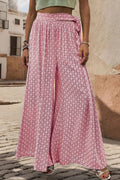 Pink printed tied wide-leg pants with gathered elastic waistband and flowing wide legs