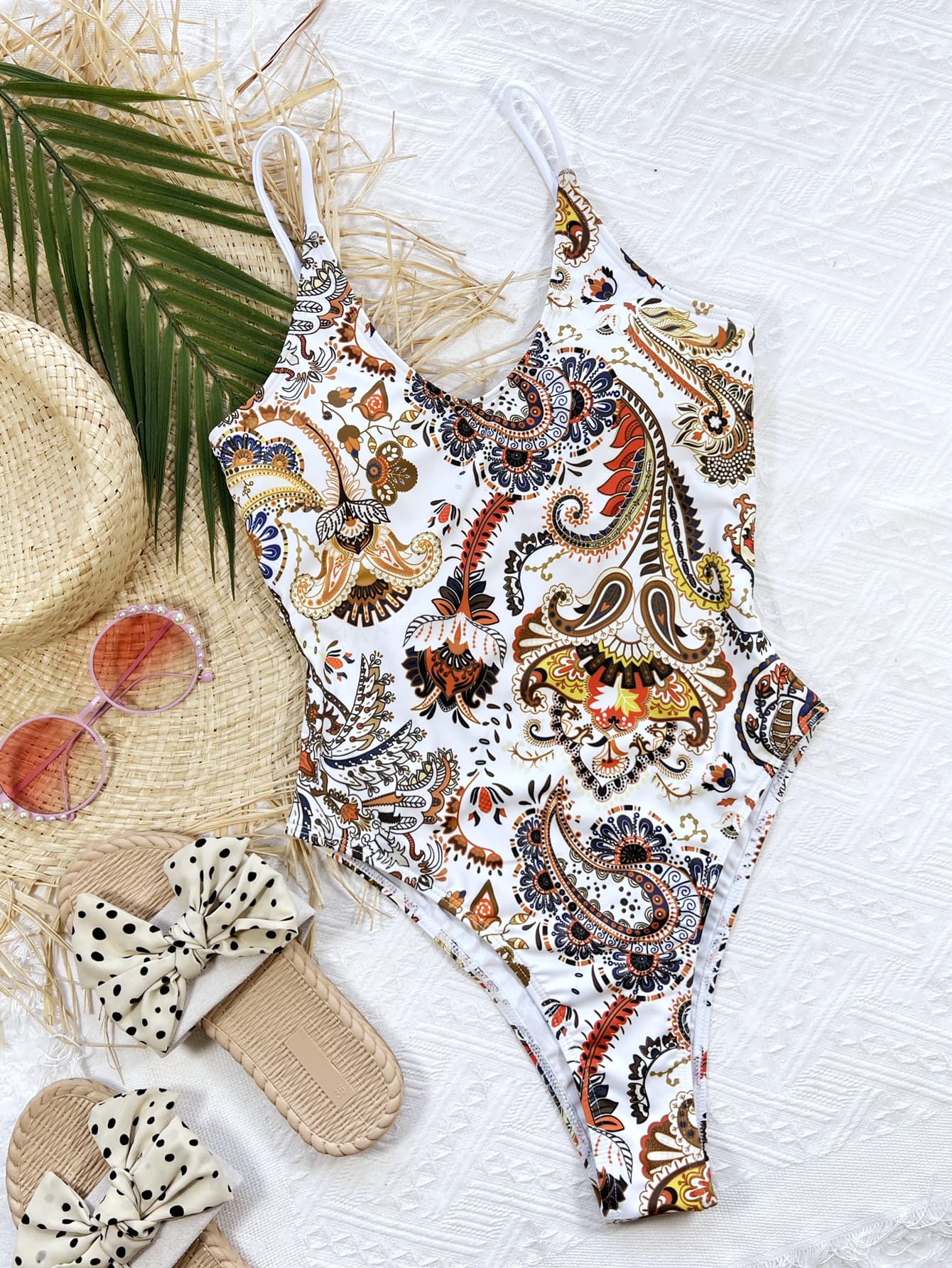 White paisley printed one-piece swimsuit with scoop neck and adjustable tie-back