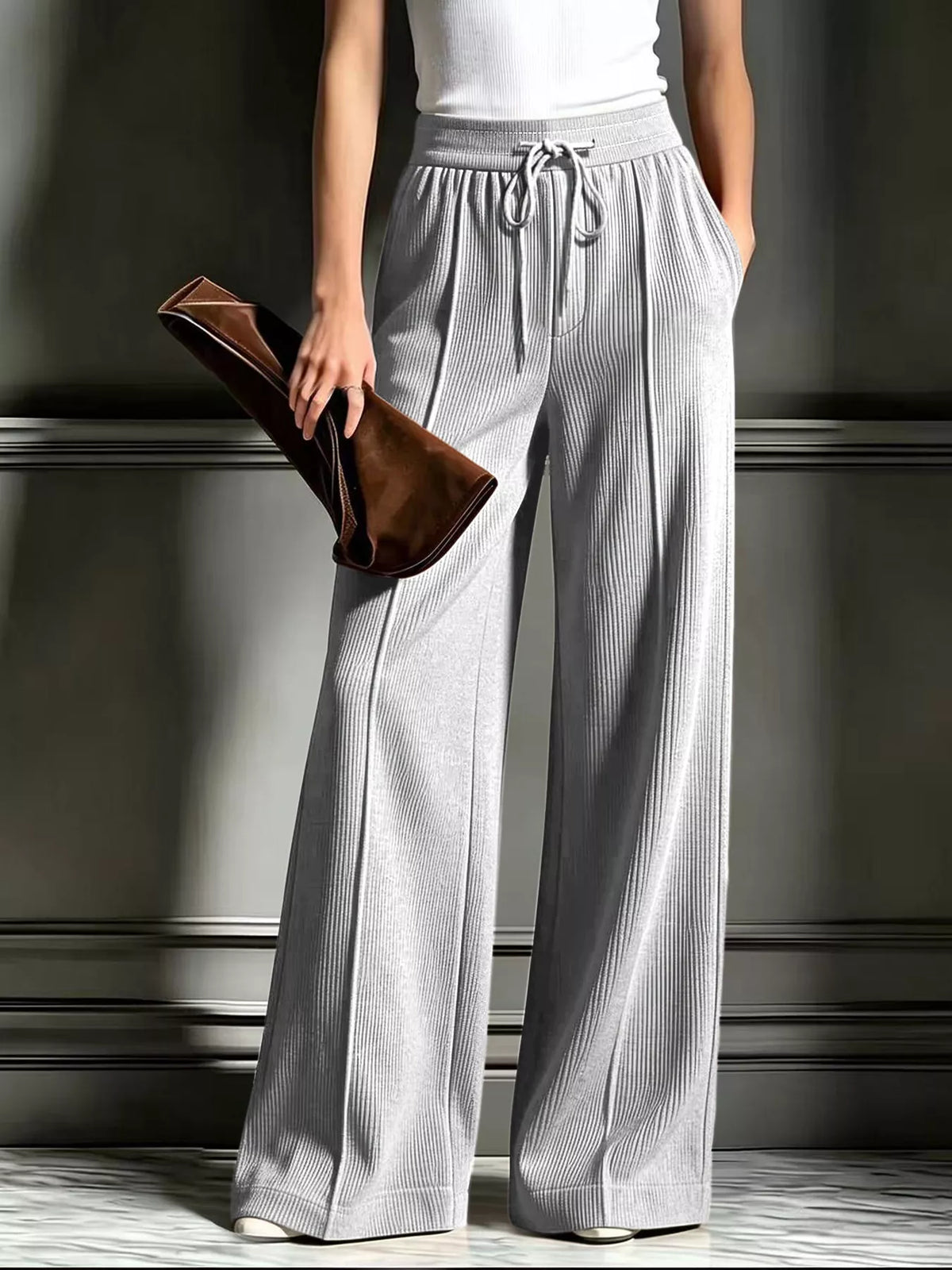 High-waisted wide-leg ribbed corduroy pants in light gray with drawstring waist