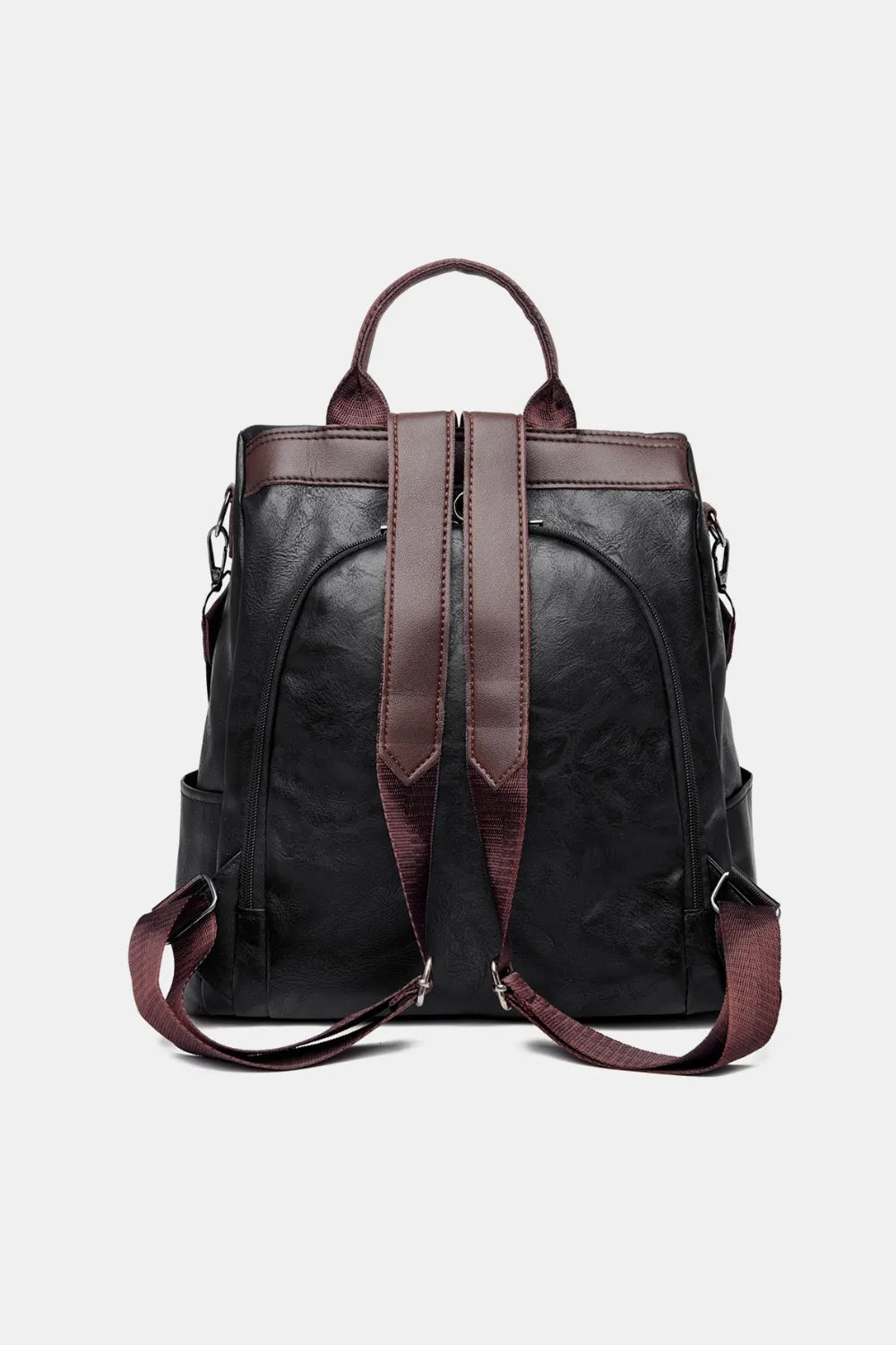 Black vegan leather backpack bag with two top handles and brown-trim shoulder straps