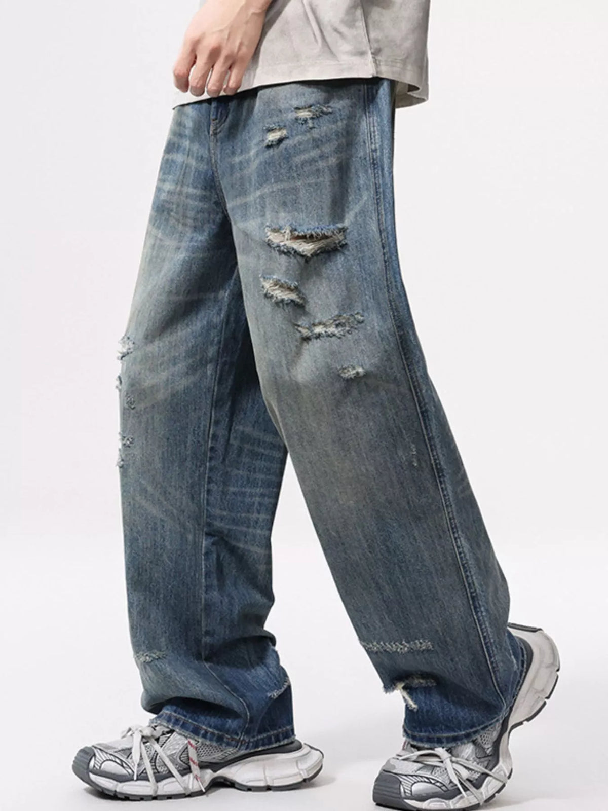 Men's wide-leg distressed washed cotton jeans, blue with large front and thigh rips