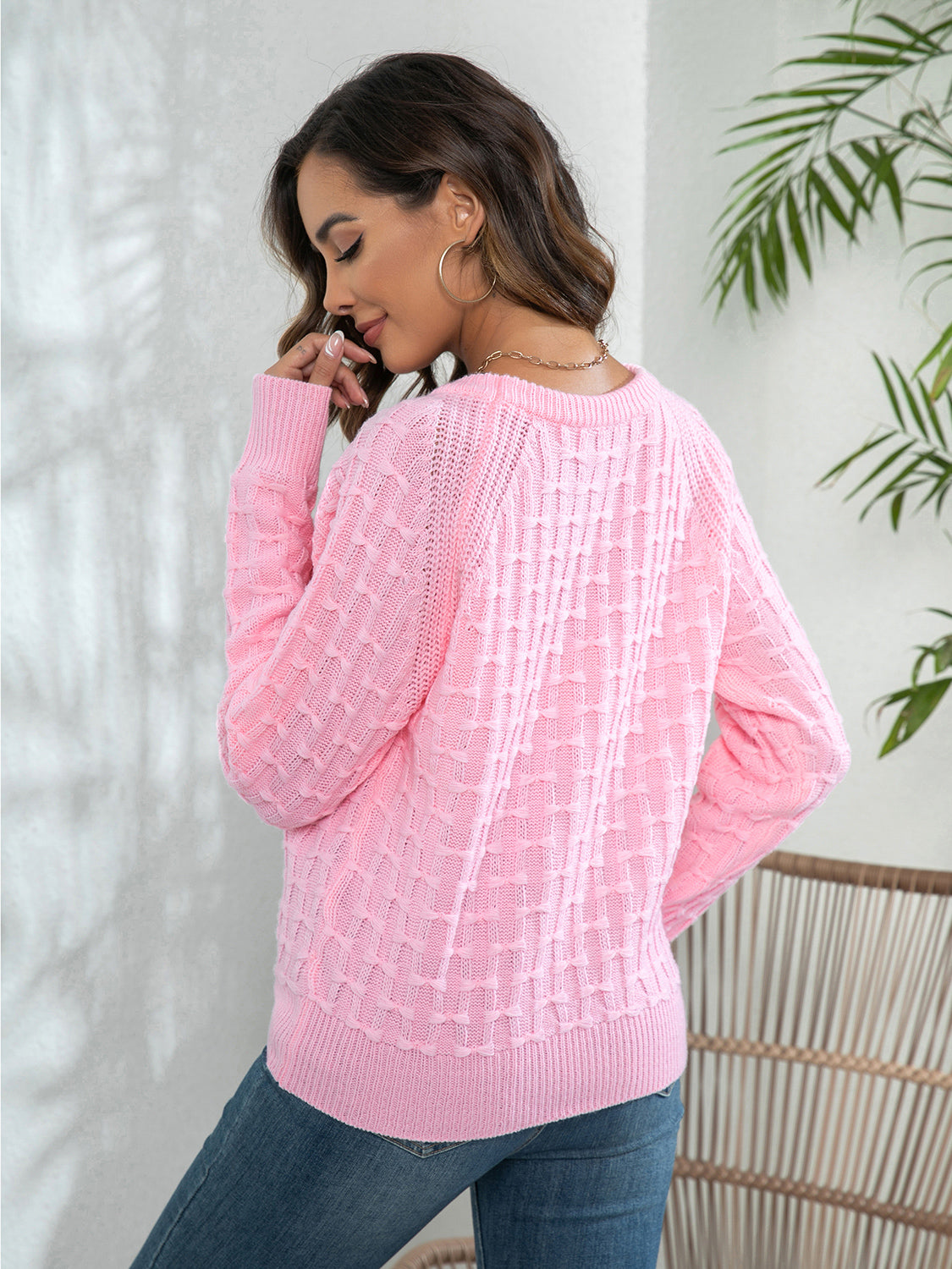 Pink long-sleeve sweater with textured knit and crewneck