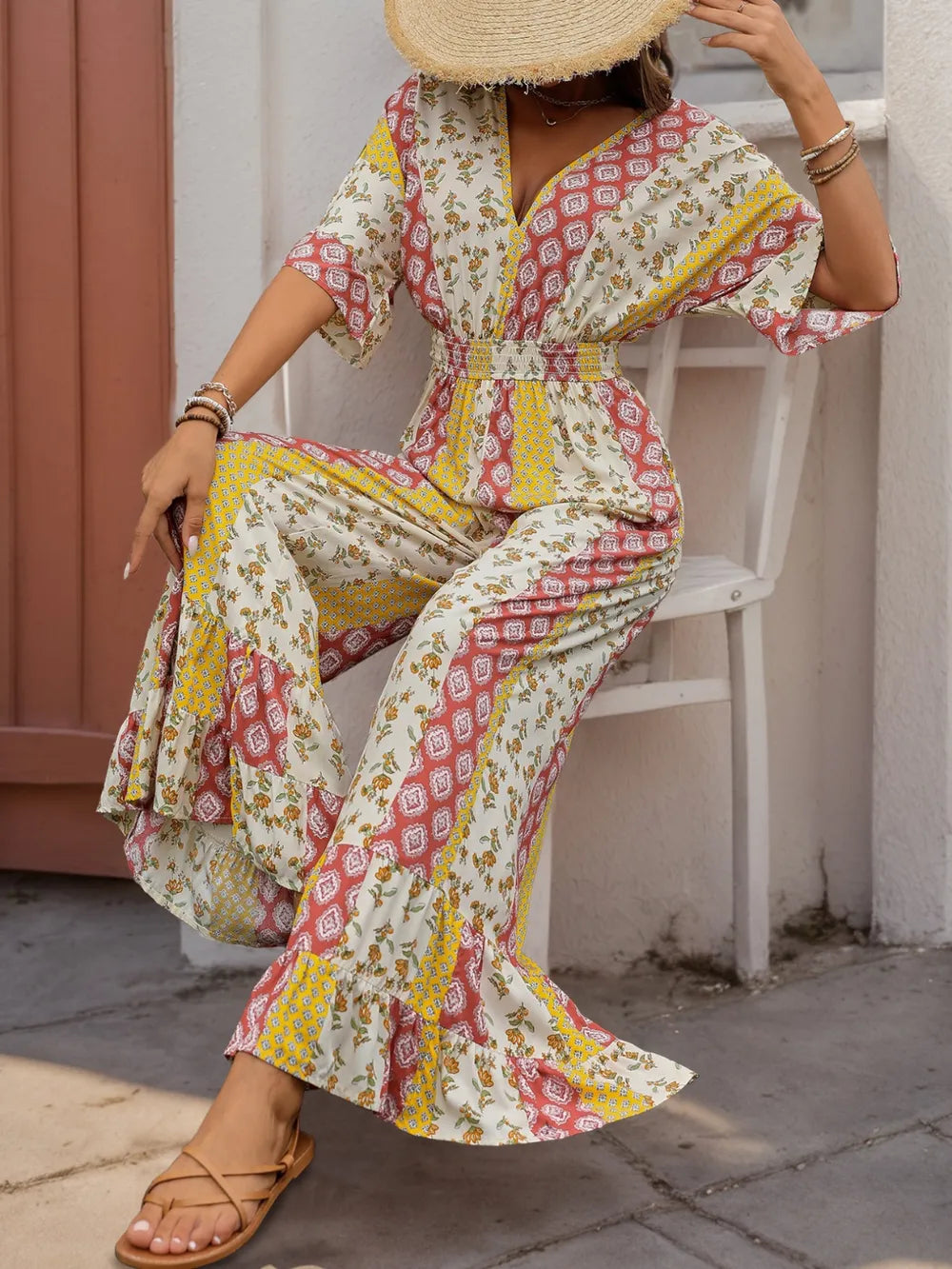 Multicolor printed V-neck jumpsuit with ruffled cuffs, tie waist, wide-leg pants