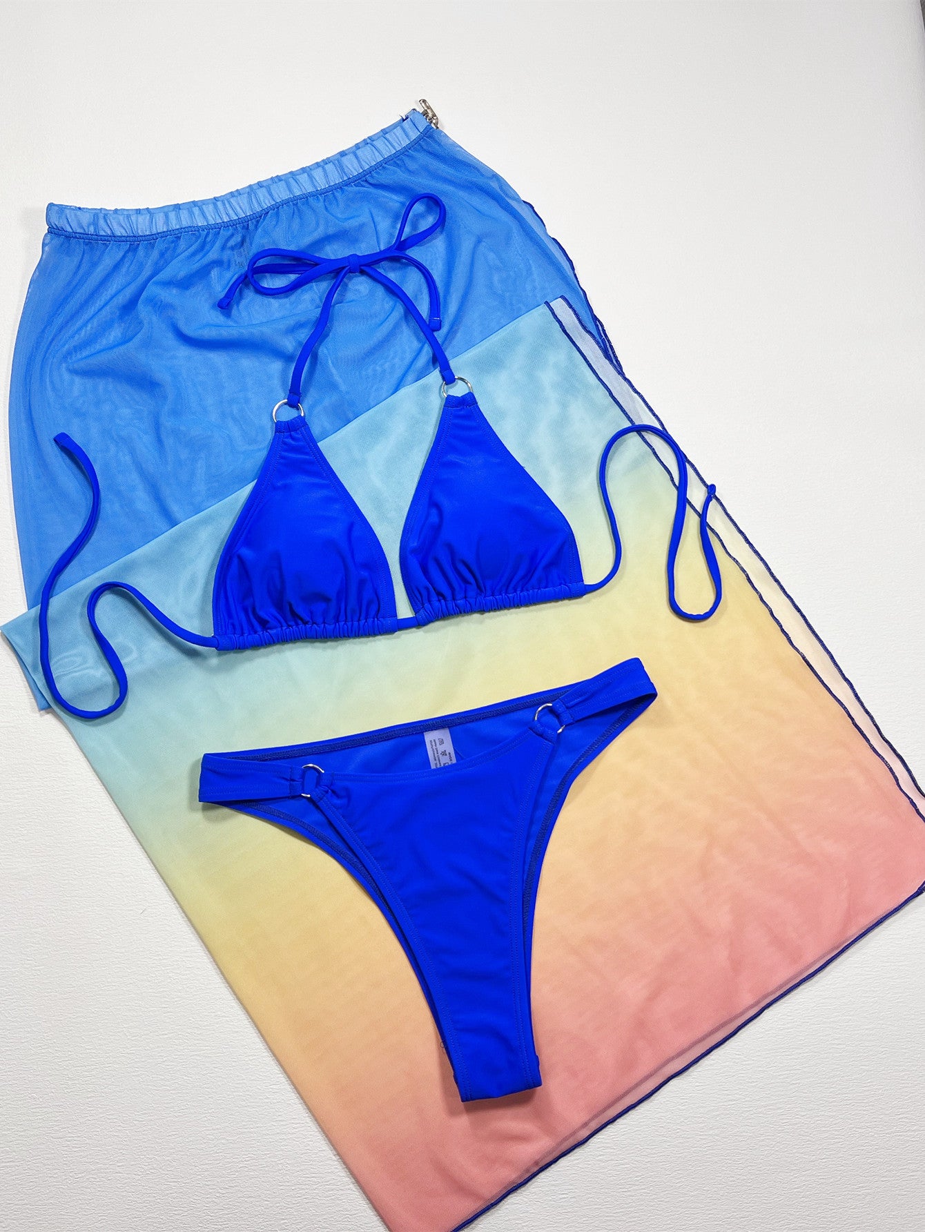 Royal blue triangle bikini top and matching high-cut swim bottom with adjustable ties