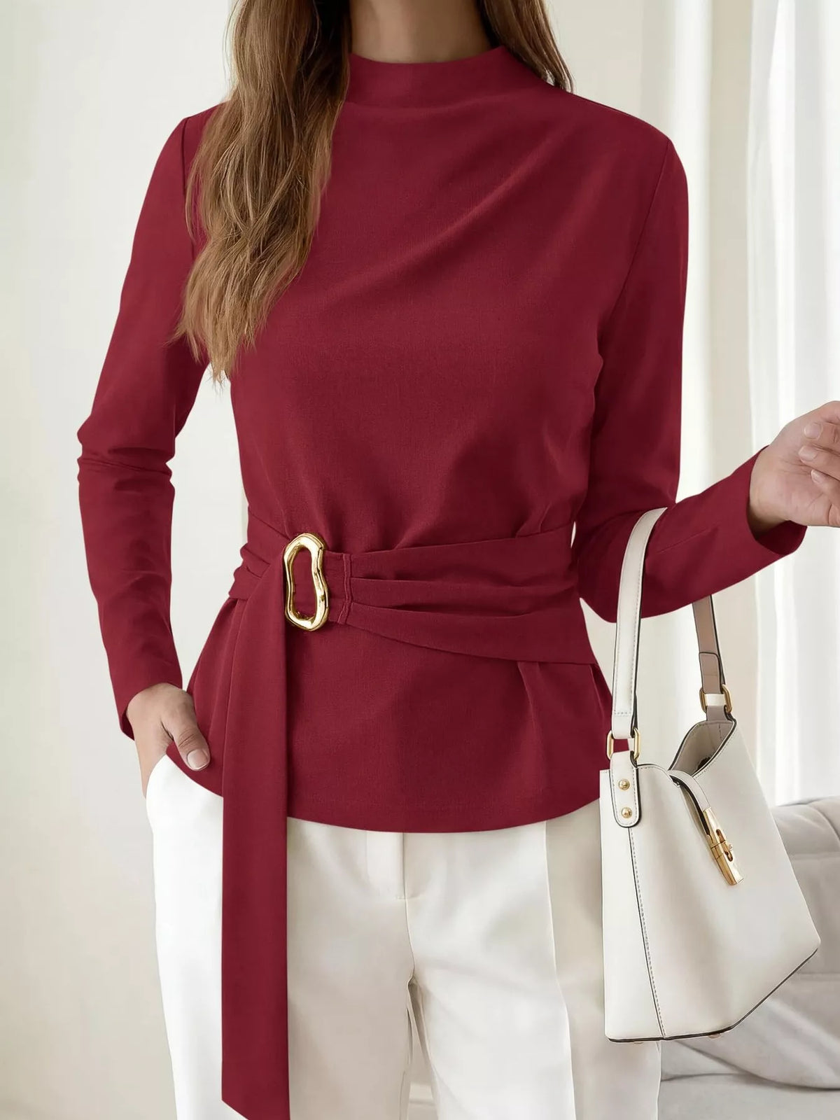 Burgundy mock neck blouse with ruched waist belt and gold ring detail