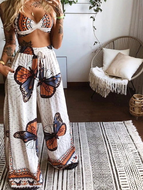 Two-piece boho top and pants set with white base, orange and blue butterfly motifs