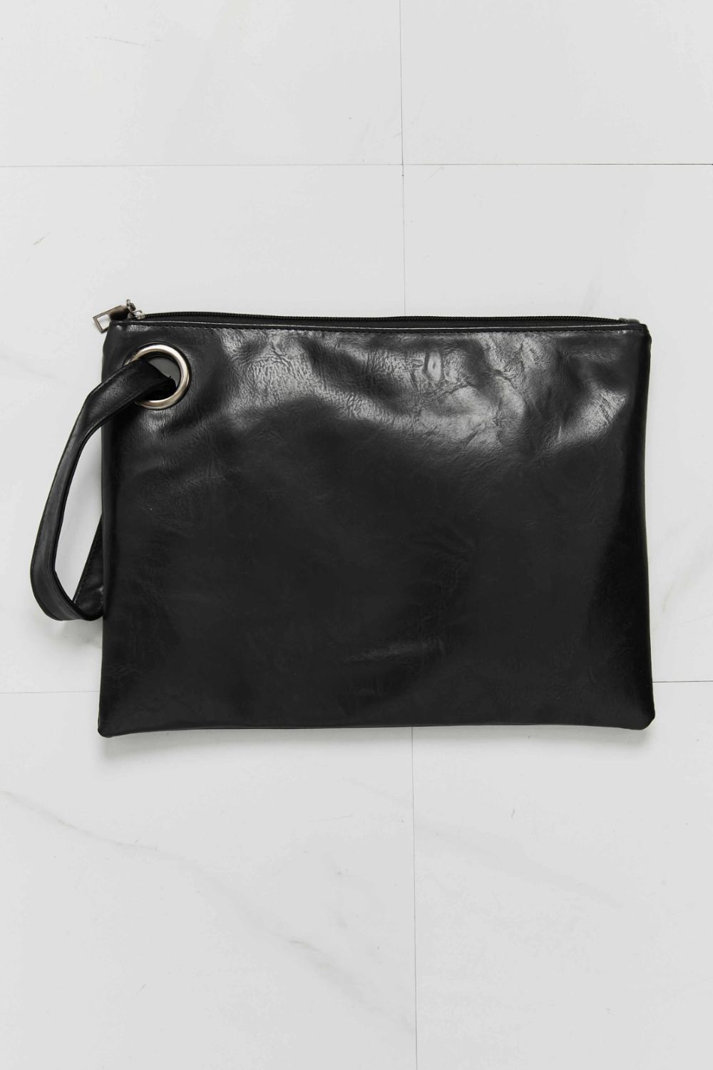 Black vegan leather wristlet clutch with wrist strap, ring hardware, zippered top
