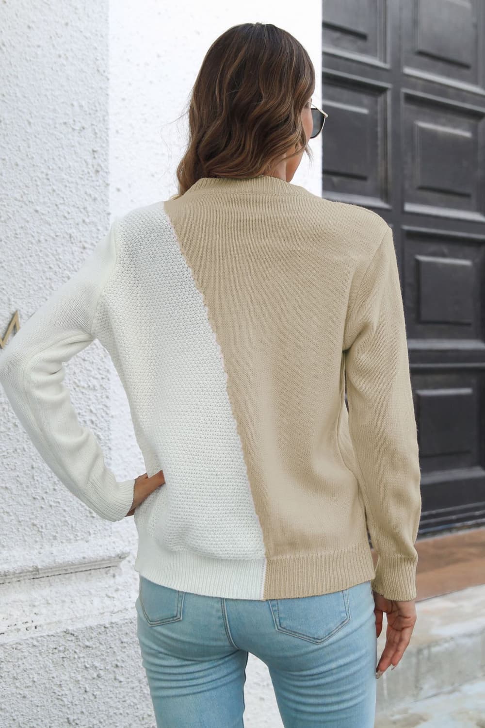 Back view of contrast color long-sleeve sweater, beige with white diagonal panel