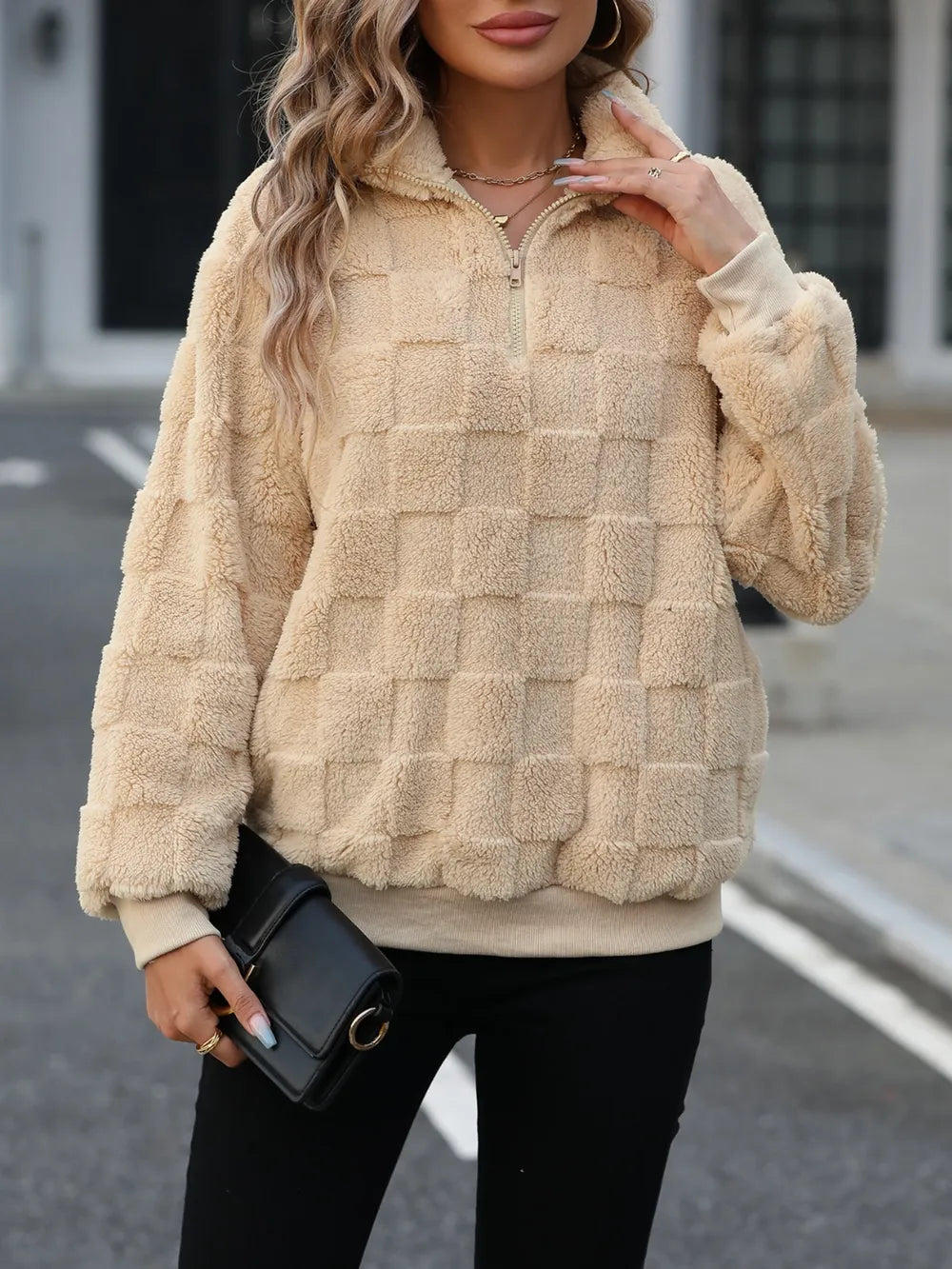 Tan fuzzy quarter-zip sweatshirt, check-textured fleece, long sleeves.