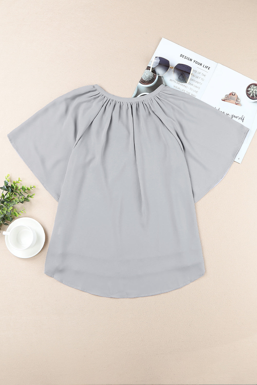 Dusty blue gathered flutter sleeve top with notched neckline