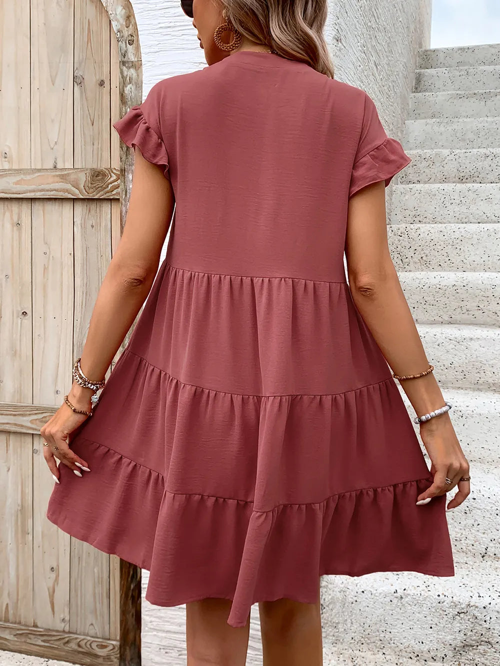 Perfee tiered dusty-rose mini dress with flounce sleeves and tiered ruffles, back view